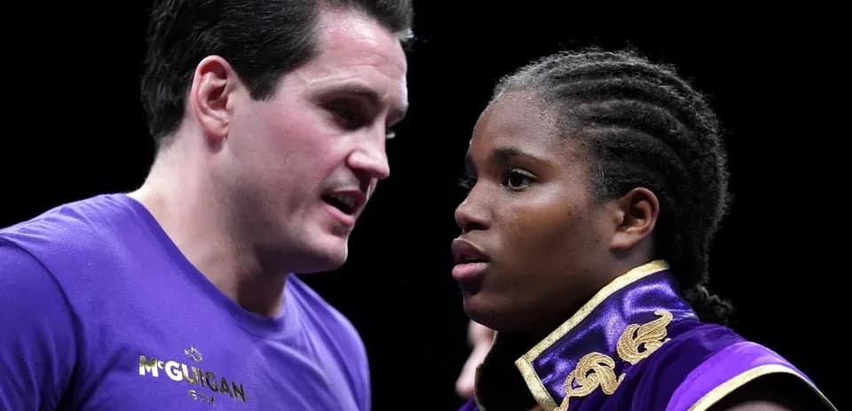 Boxer and coach discussing strategy before match