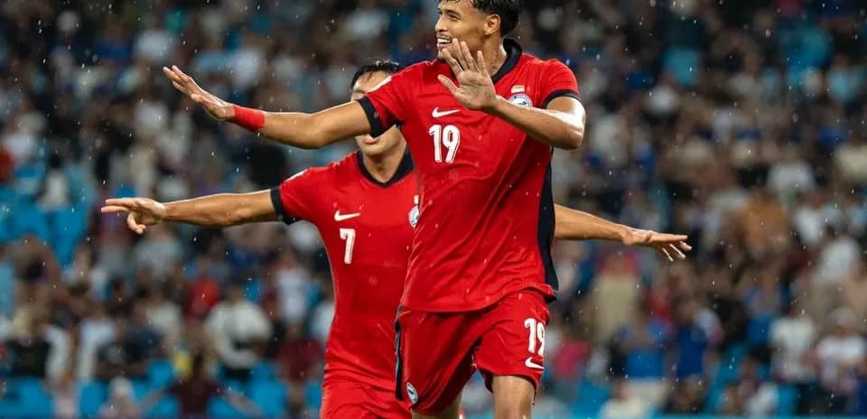 Football player celebrating goal during match