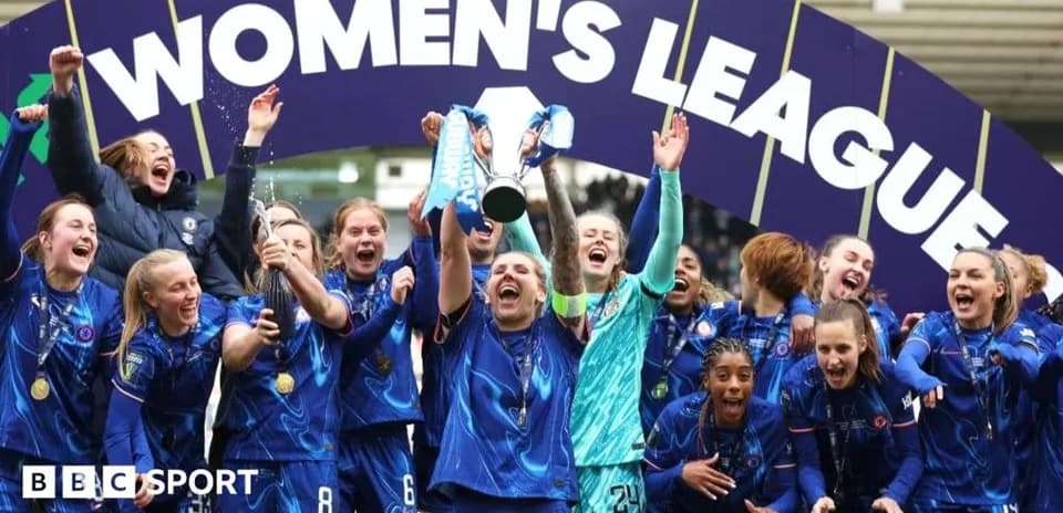 Chelsea women's team celebrating league victory with trophy