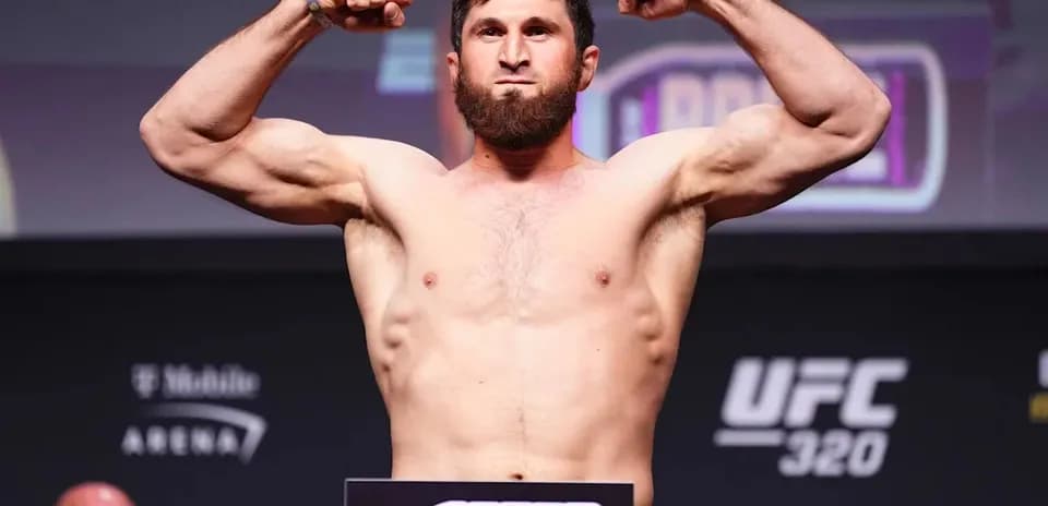 Brawler flexing muscles at UFC weigh-in event
