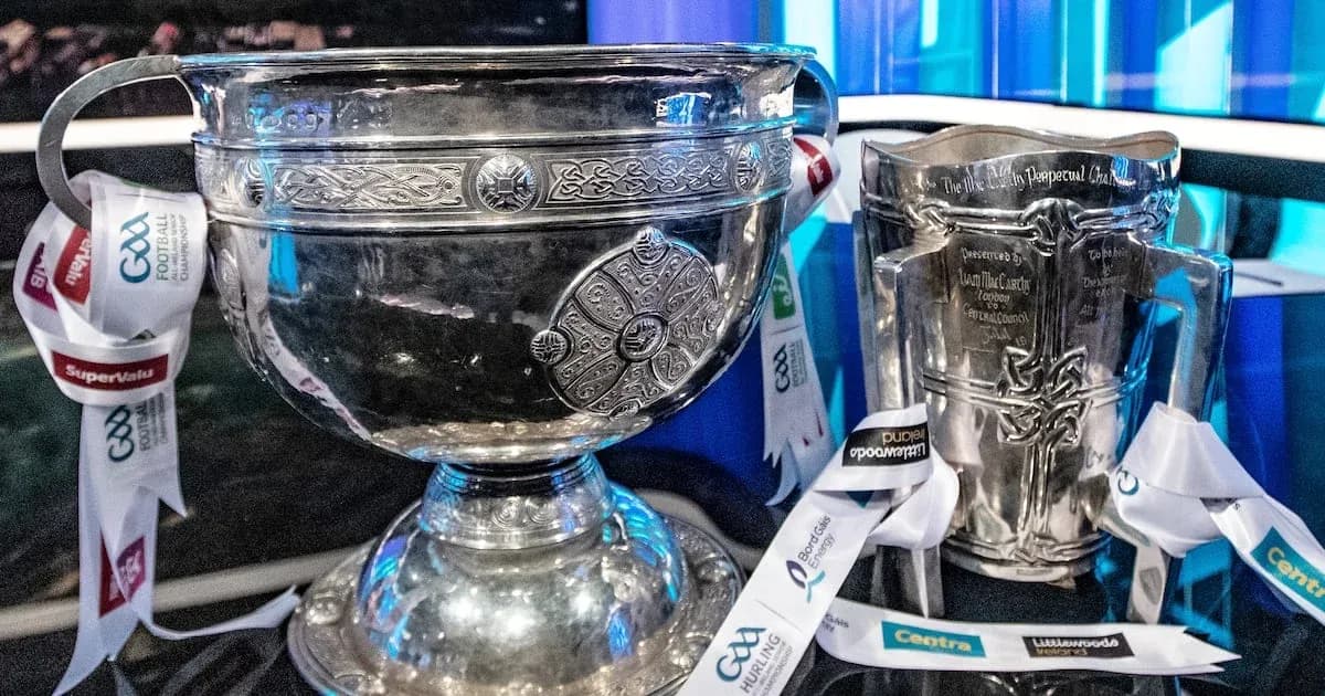 GAA trophies displayed with sponsor ribbons