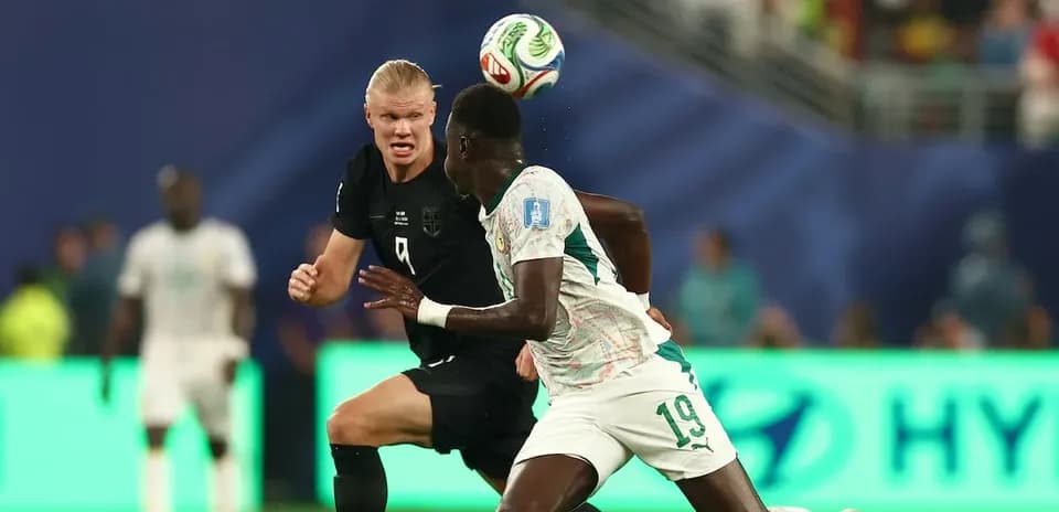 Player heading the ball during match action