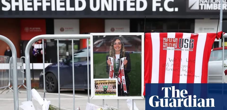 Memorial with flowers and tribute outside stadium