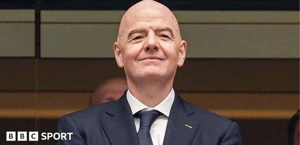 Man in suit smiling at an event