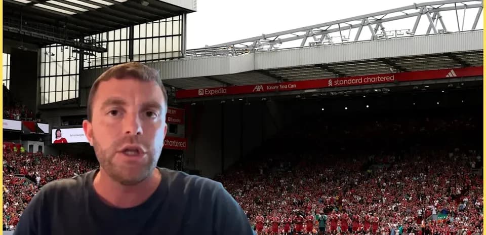 Analyst speaking in front of stadium crowd