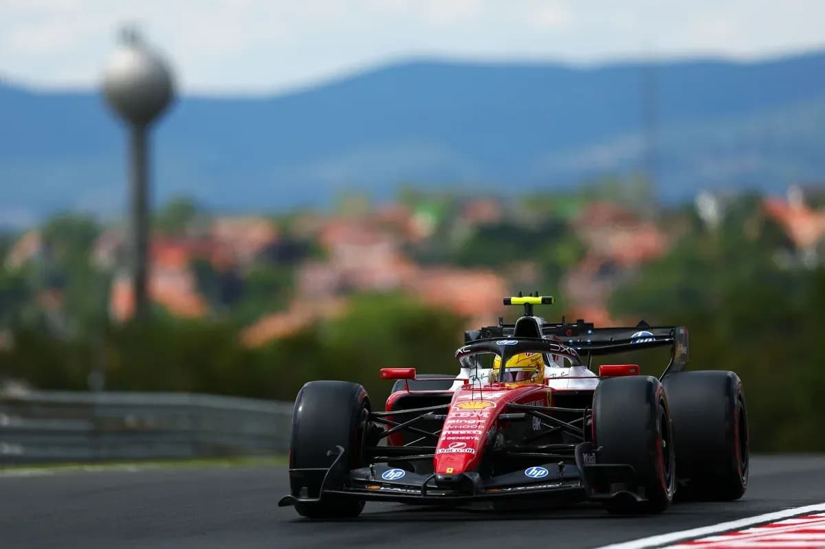 Formula 1 car racing on track with hills background Formula 1 car racing on track with hills background