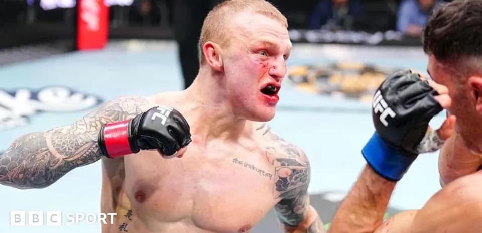 Fighter delivering a punch in the octagon