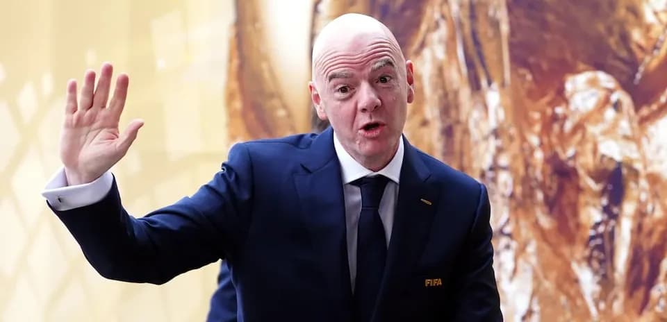 FIFA official gesturing during event presentation