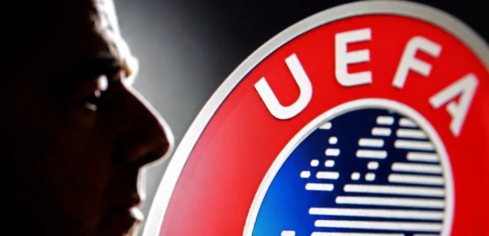 Shadows of a man beside UEFA logo