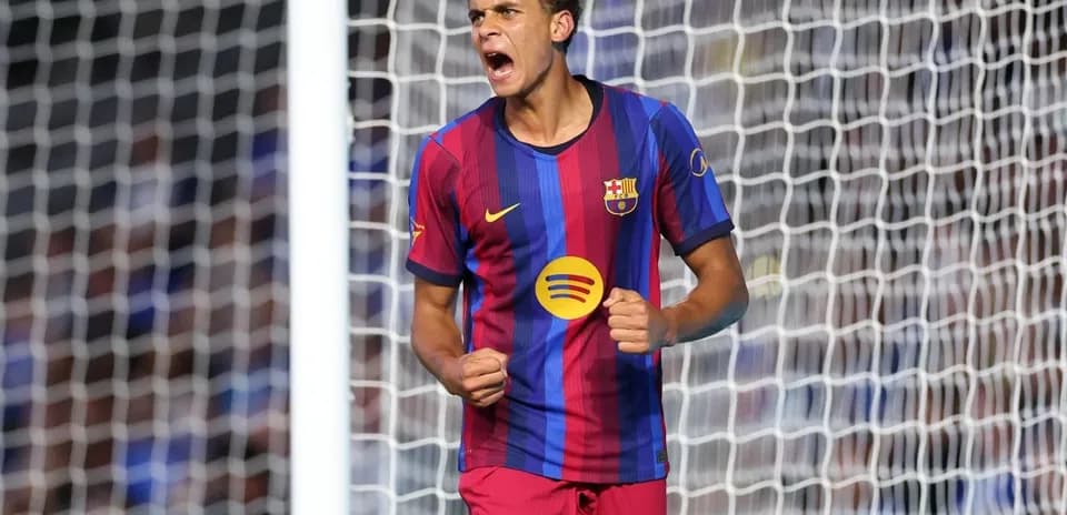 Barcelona player celebrating a goal in stadium