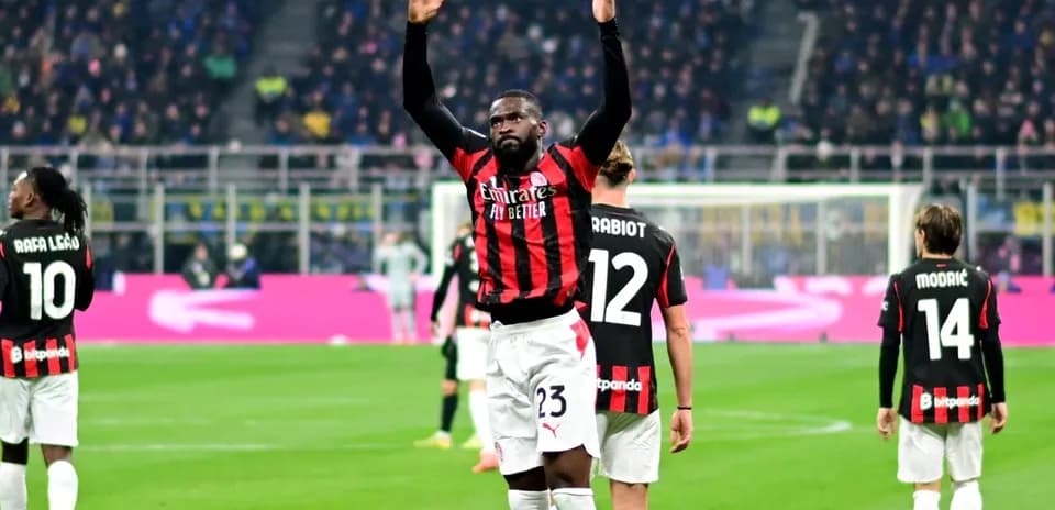 AC Milan players celebrating during match at stadium
