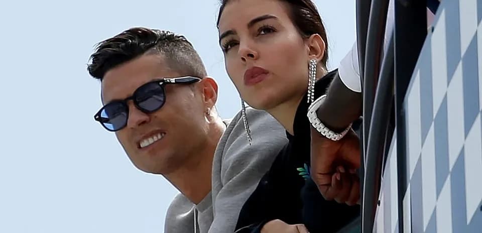 Couple watching an event from a balcony