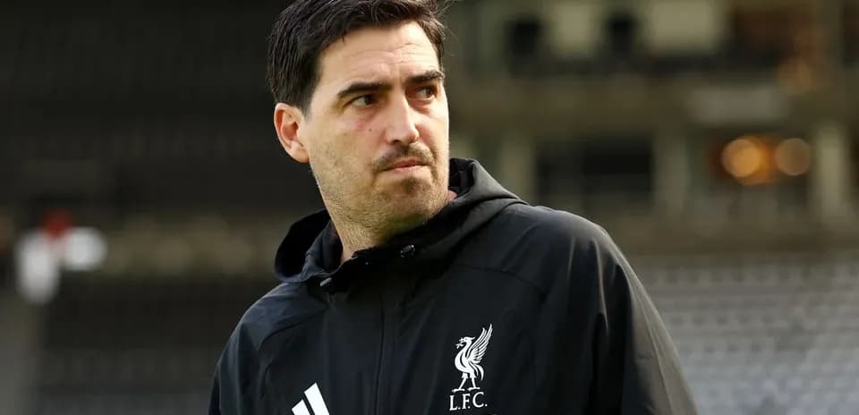 Liverpool coach observing the training ground