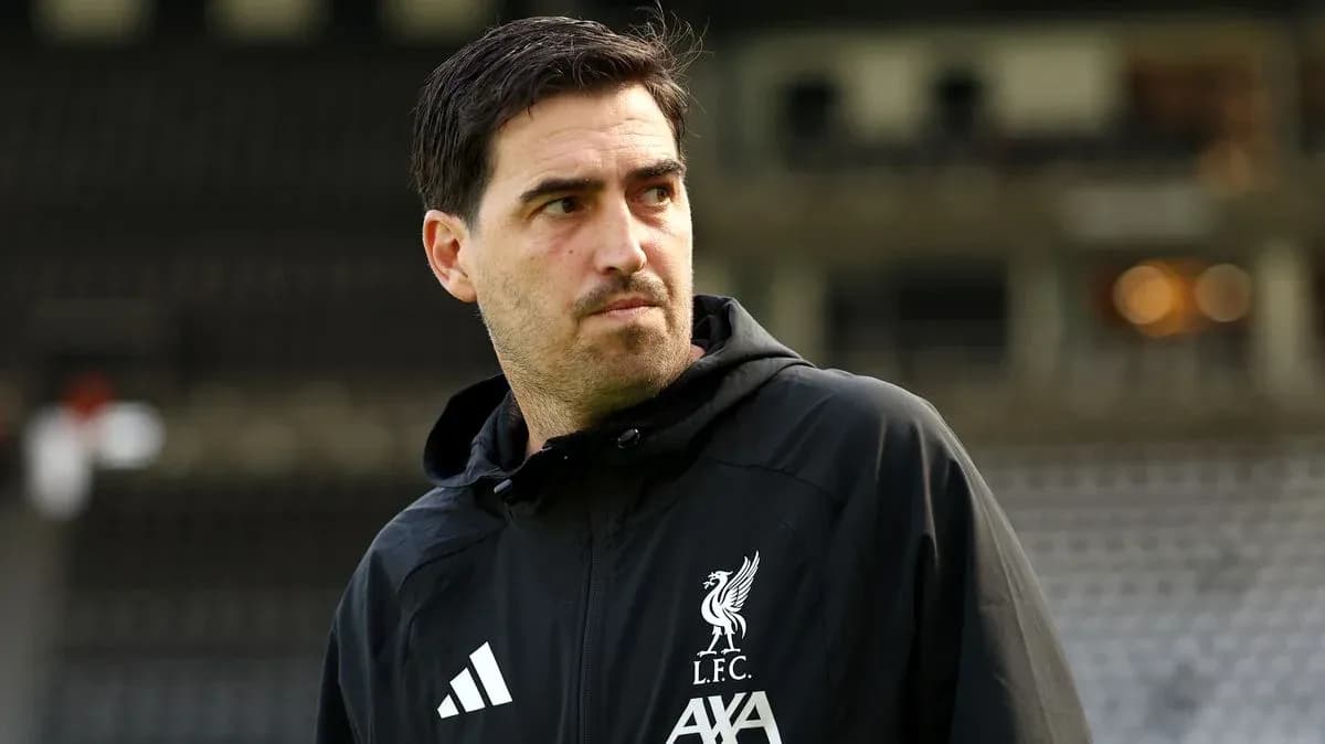 Liverpool coach observing the training ground