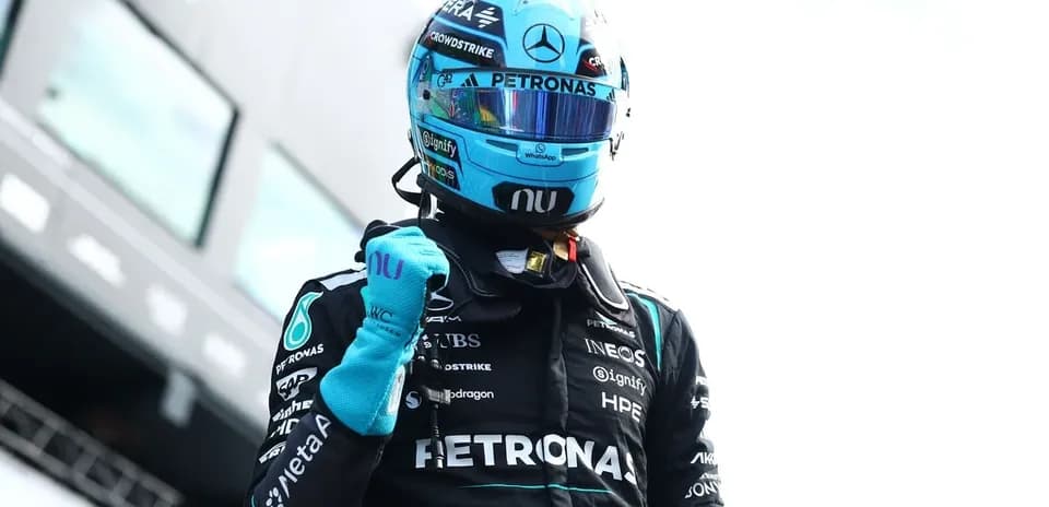 Pilot celebrating after race in Mercedes suit
