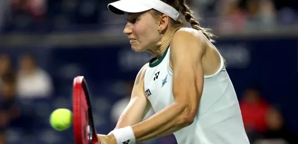Tennis player hitting the ball during match