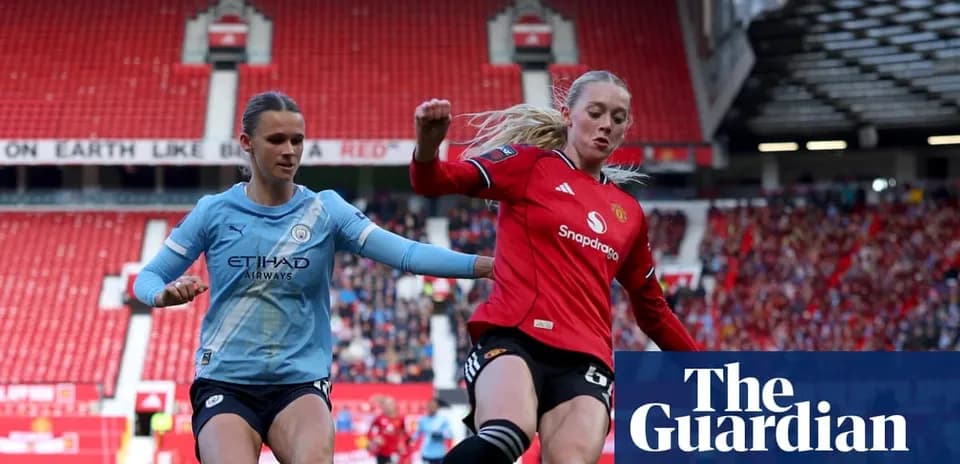 Two female football players competing for the ball