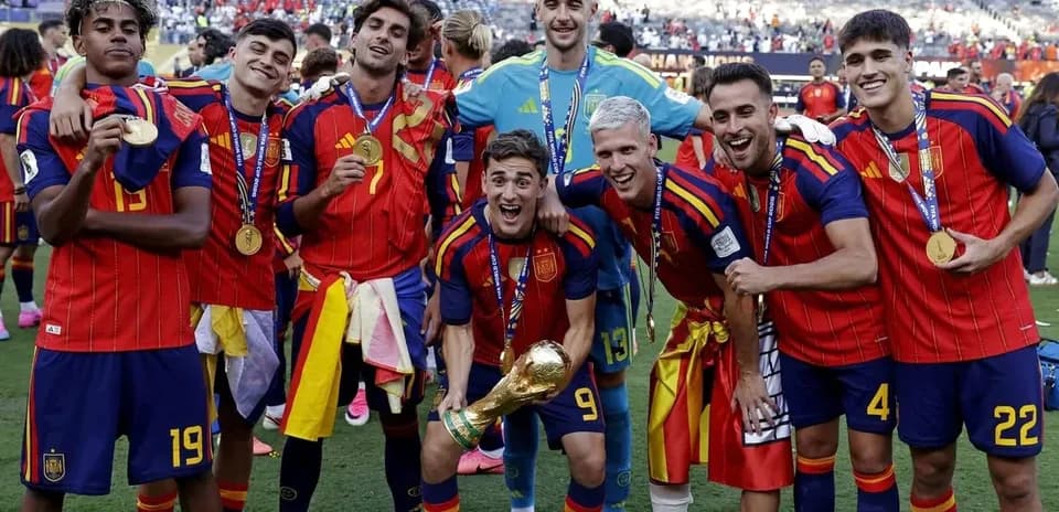 Spain team celebrating with trophy after victory