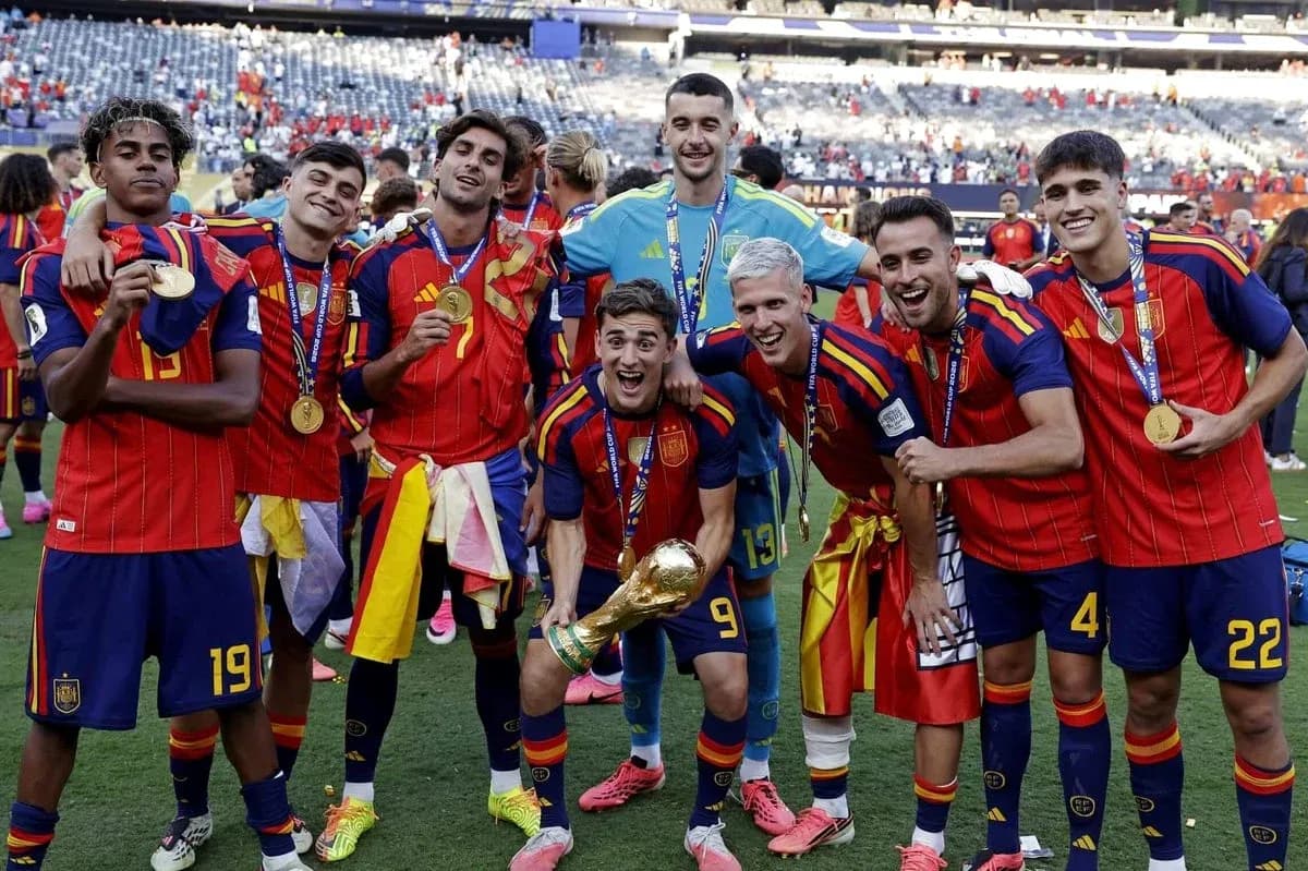 Spain team celebrating with trophy after victory