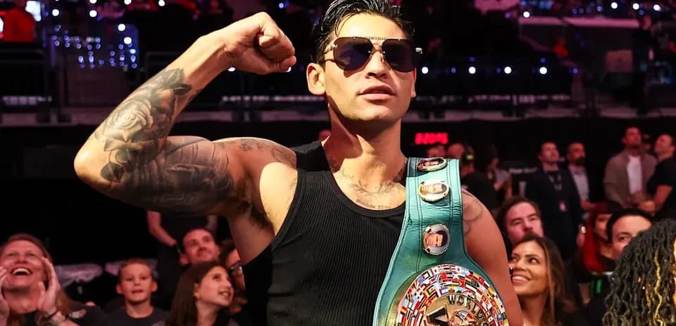 B boxer celebrating with championship belt in crowd