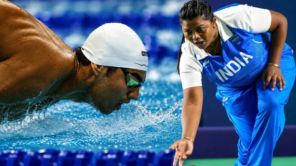 Swiimmer competing with coach at the poolside