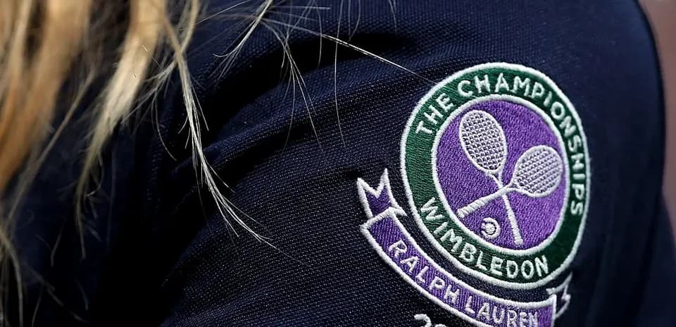 Wimbledon logo on a navy blue shirt sleeve