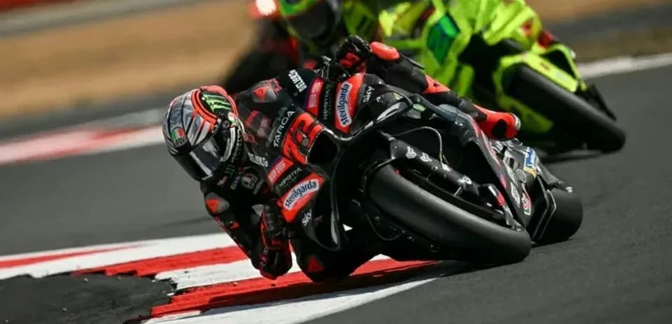 Motorcyclists racing on track during competition