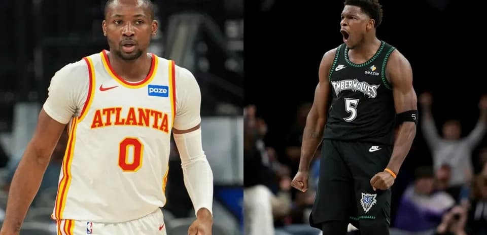 Two basketball players in team jerseys on court
