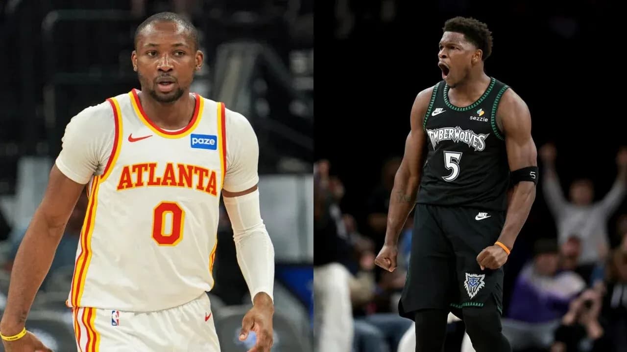 Two basketball players in team jerseys on court