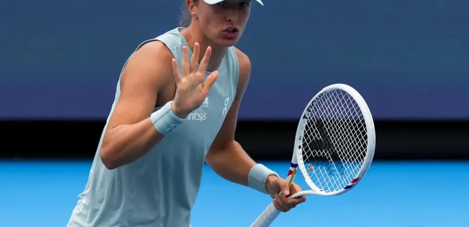 Tennis player gesturing during match on court