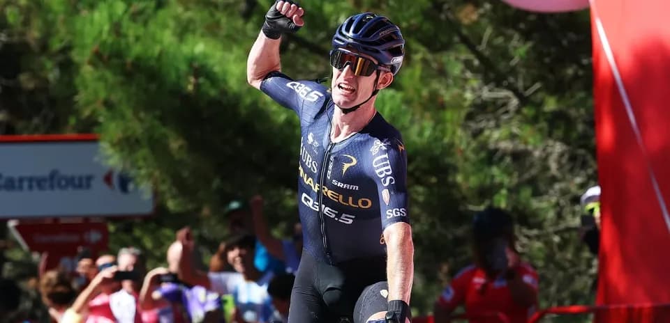Cyclist celebrating victory at finish line
