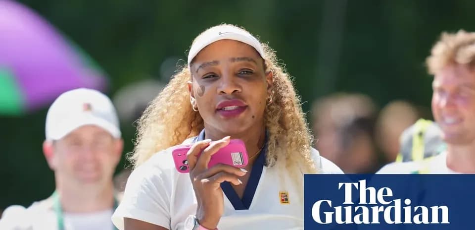 Tennis player holding phone during event