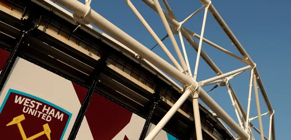West Ham United stadium structure against blue sky