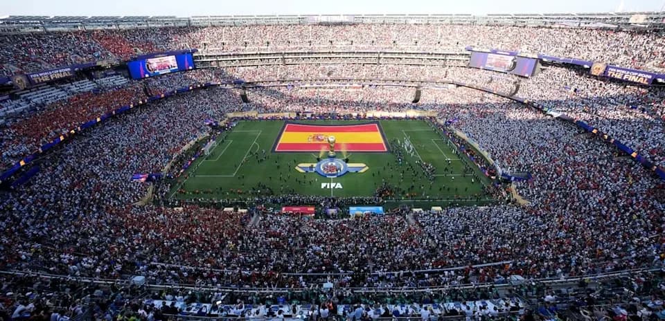 FIFA World Cup final with large crowd and Spanish flag