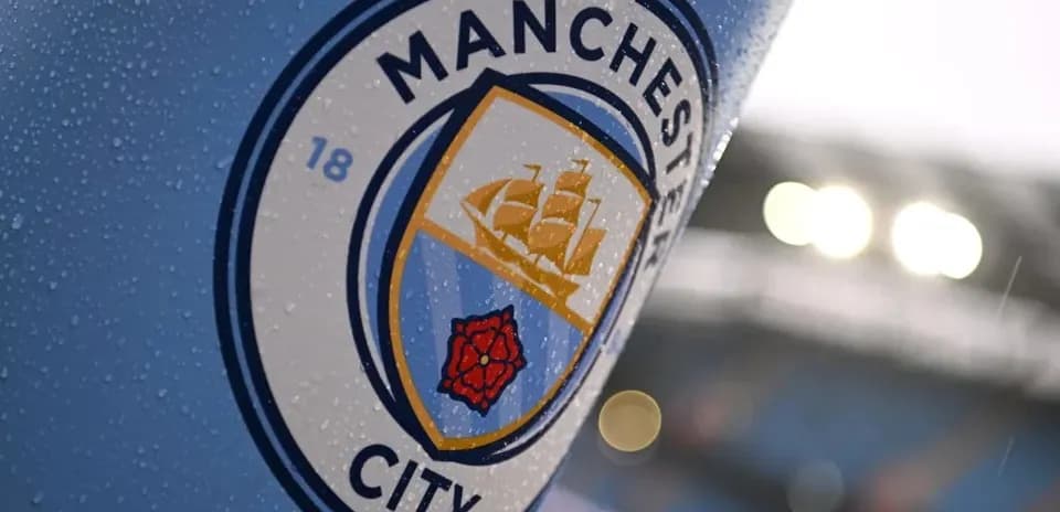 Manchester City club logo on a rainy day