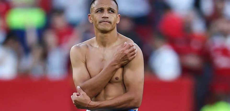 Football player with bare torso on field