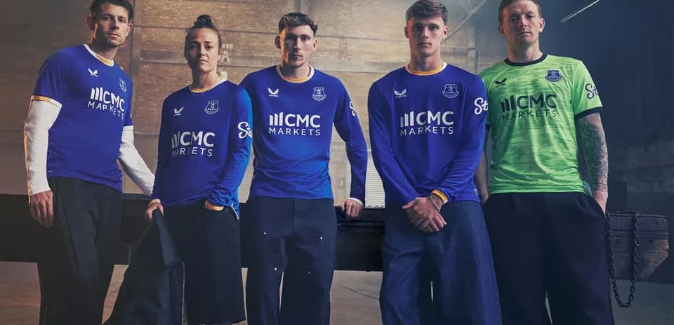 Everton players posing in new team kits