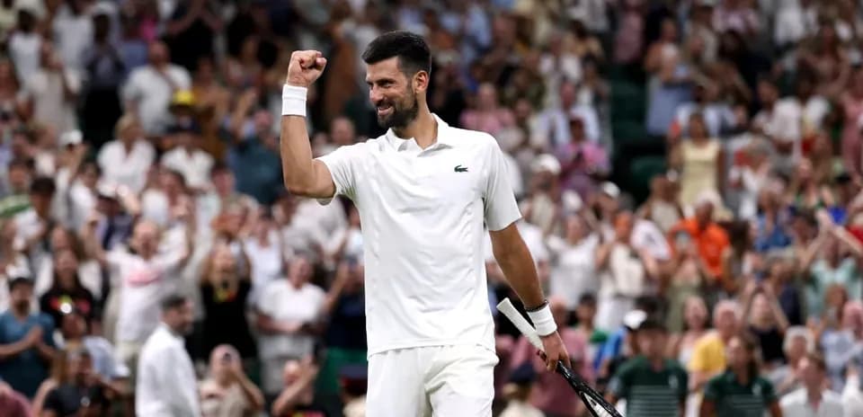 Tennis player celebrating victory at Wimbledon