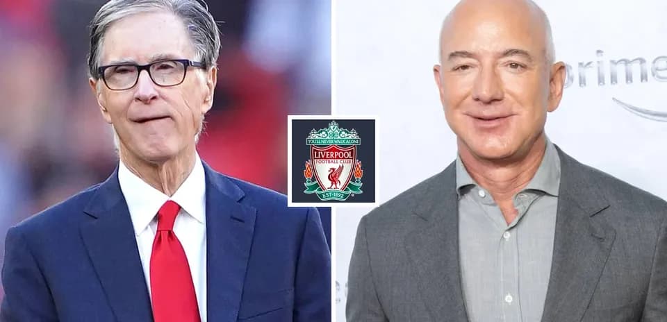 Two men beside Liverpool FC logo