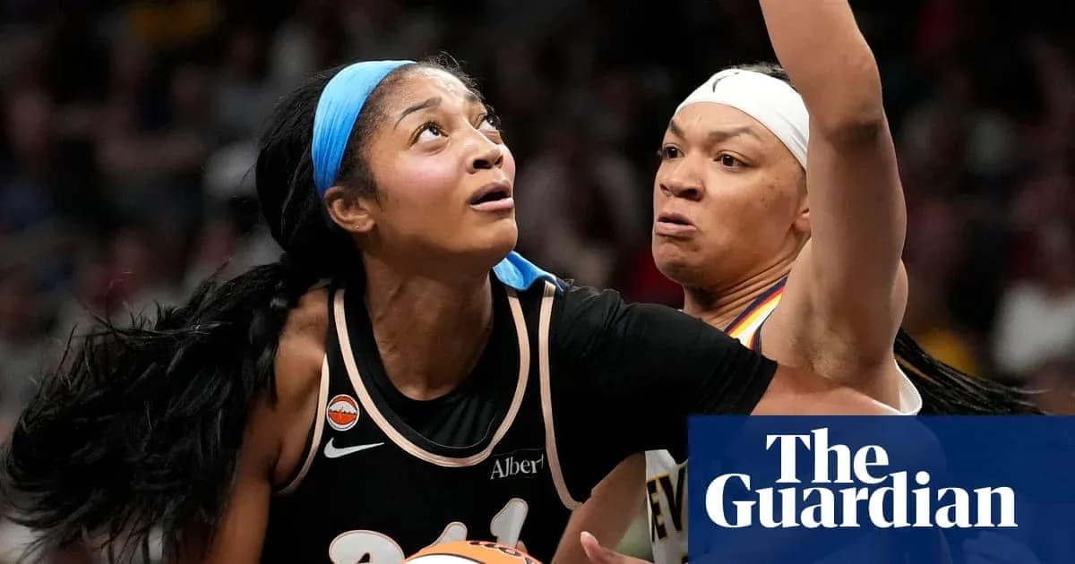 Two basketball players competing for the ball