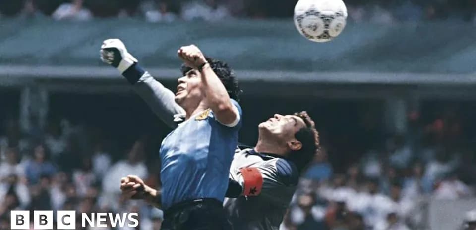 Goalkeeper jumping for the ball during match
