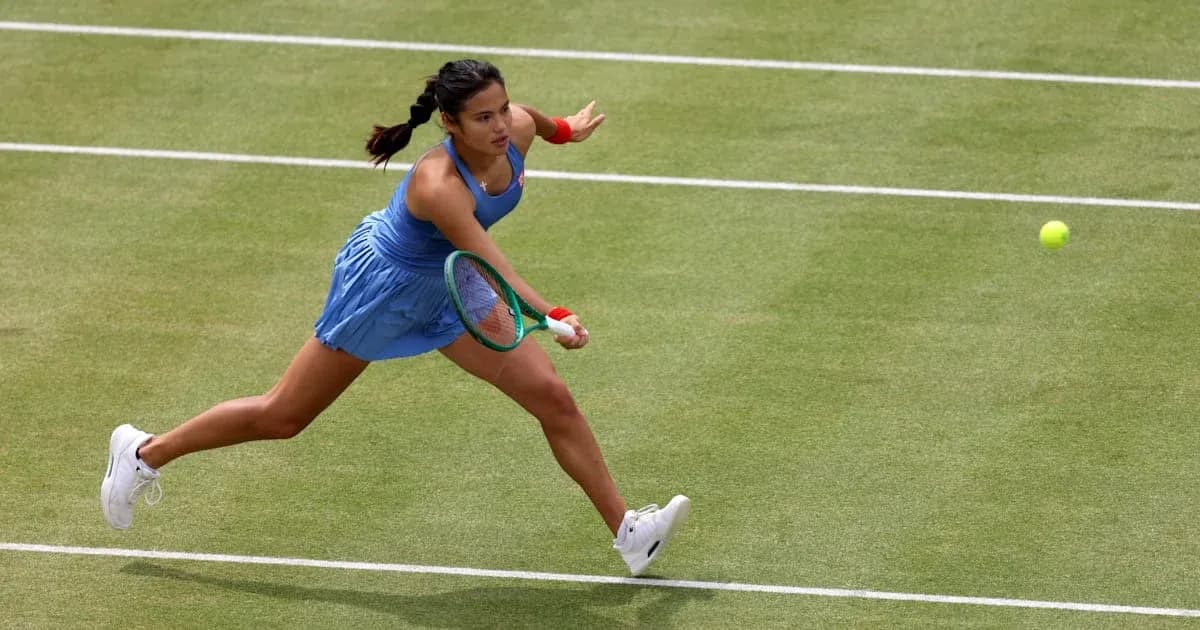 Tennis player reaching for a flying ball on court Tennis player reaching for a flying ball on court