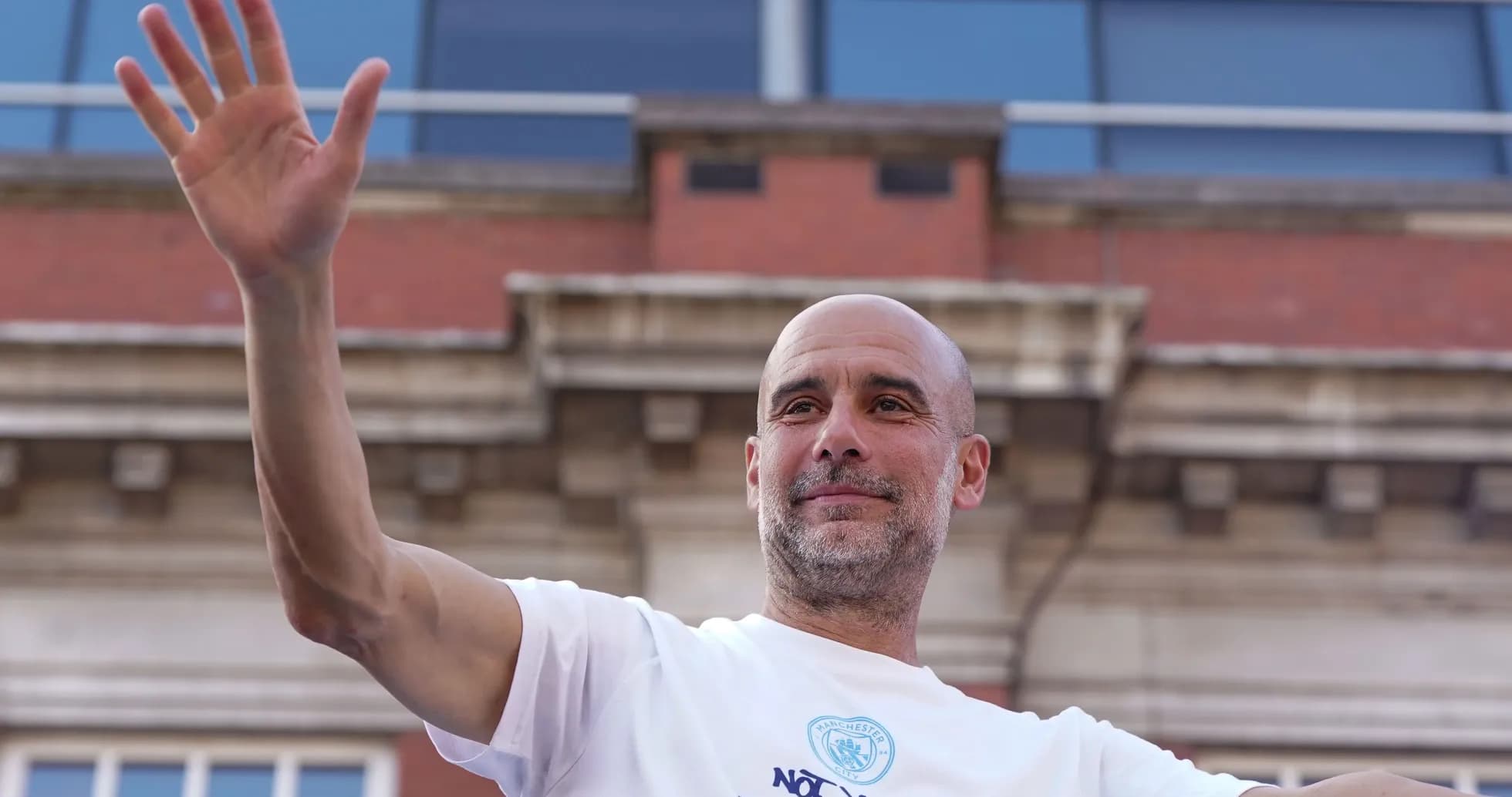 Coach waving during celebration event in city