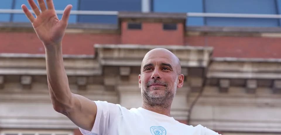 Coach waving during celebration event in city
