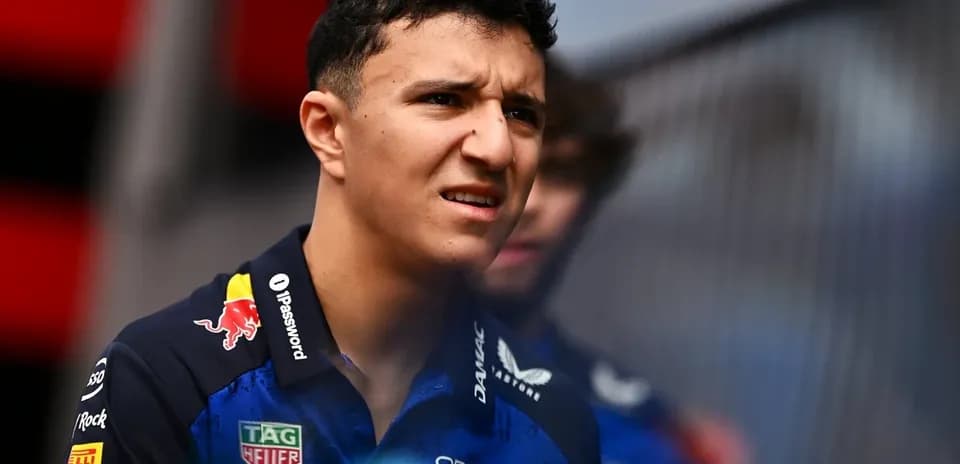 F1 driver in Red Bull Racing team uniform