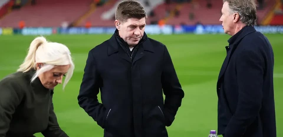 Analysts discussing on the pitch after match