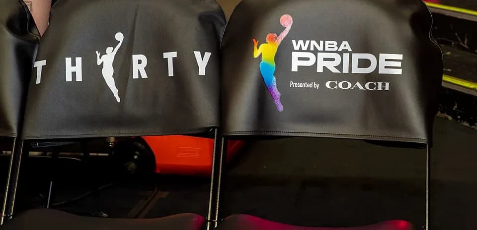 Chairs with WNBA Pride branding at event