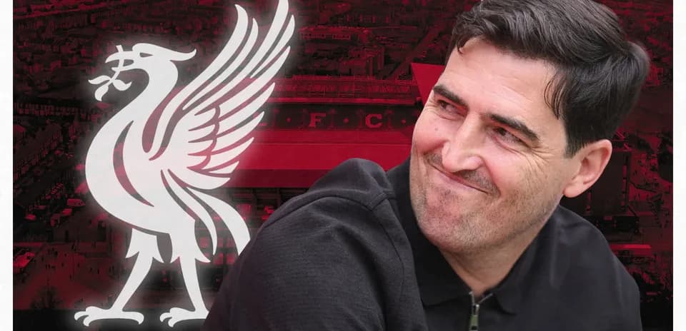 Person smiling with Liverpool FC logo in background