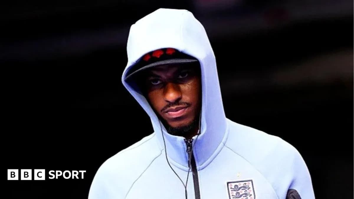 Sporting figure in hoodie preparing for event Sporting figure in hoodie preparing for event