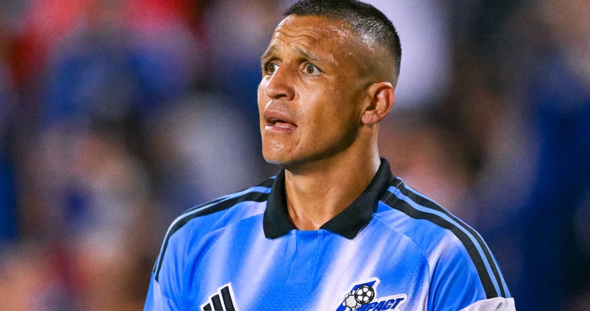 Referee in blue uniform during soccer match